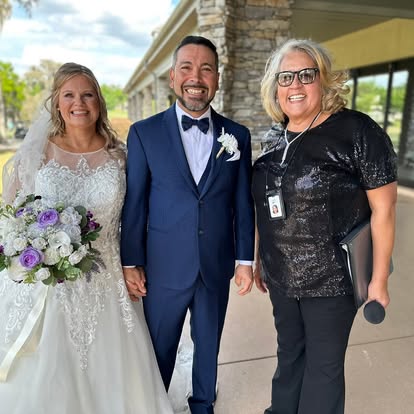 Esther with newlyweds in a garden