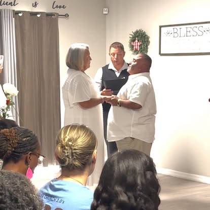 Esther officiating an indoor wedding ceremony