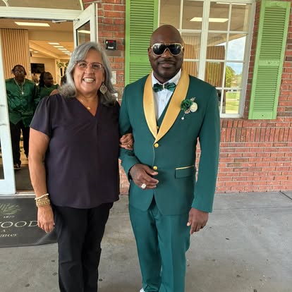 Esther with a groom in a green and gold suit